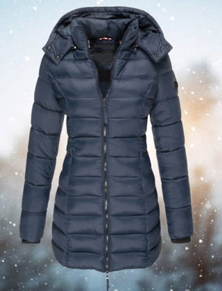 Emily women's long hooded quilted puffer coat with padded insulation, shown on a model, featuring a sleek longline design.