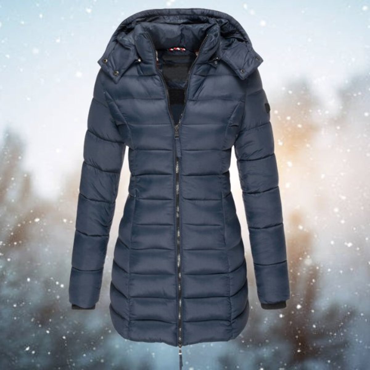 Emily women's long hooded quilted puffer coat with padded insulation, shown on a model, featuring a sleek longline design.