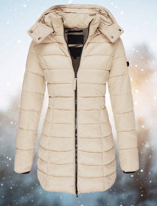 Emily women's long hooded quilted puffer coat by Christine Brewer featuring a padded design and a cozy, longline fit.