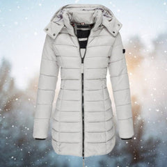 Emily women's long hooded quilted puffer jacket with padded design, shown in a stylish longline cut, by Christine Brewer.