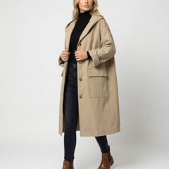 Christine Brewer Olivia women's long waterproof hooded trench coat, stylish and protective raincoat for women, with a hood and sleek design.