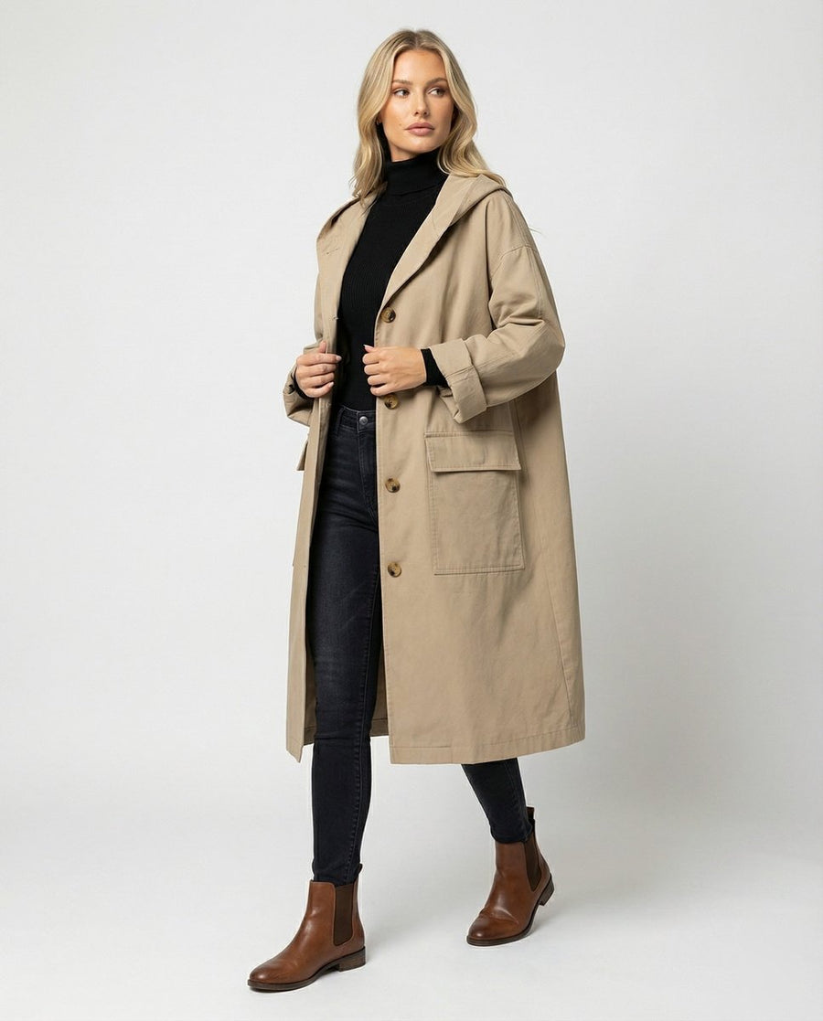 Christine Brewer Olivia women's long waterproof hooded trench coat, stylish and protective raincoat for women, with a hood and sleek design.