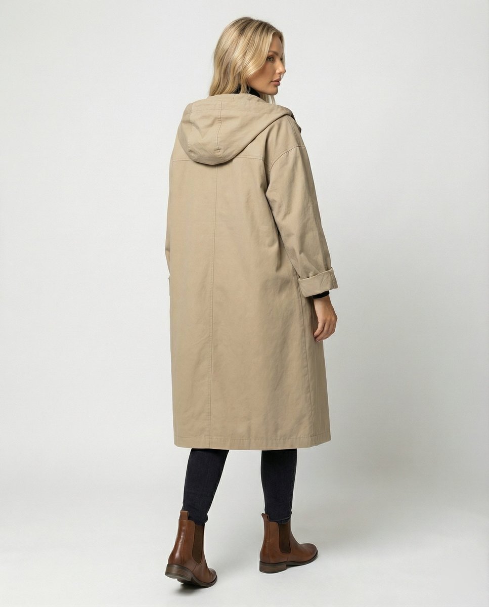 Women’s long waterproof hooded trench coat by Christine Brewer, stylish and rain-resistant outerwear for women.