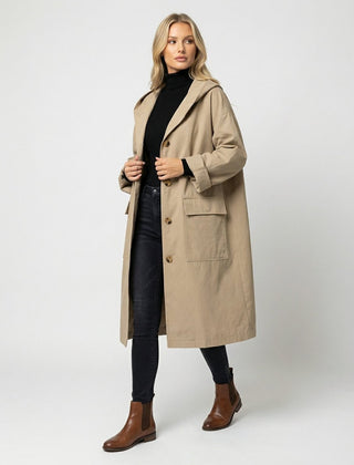 Women's long waterproof windproof hooded trench coat by Christine Brewer, stylish and protective outerwear for rainy days.
