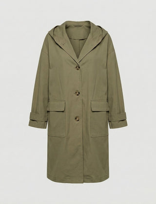 Woman wearing Christine Brewer Rosie long waterproof windproof hooded trench coat, stylish and functional outerwear for rainy days.