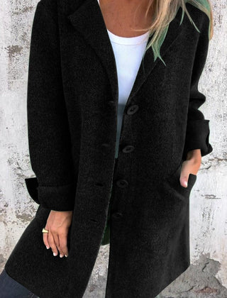 Women's longline button-up coat with lapel collar in oversized fit by Christine Brewer, showcasing stylish, warm outerwear.