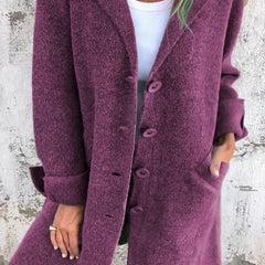 Women's longline button-up coat with lapel collar, oversized fit by Christine Brewer, styled for a chic, relaxed look.