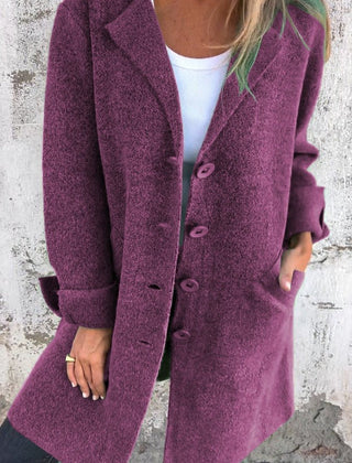 Women's longline button-up coat with lapel collar, oversized fit by Christine Brewer, styled for a chic, relaxed look.