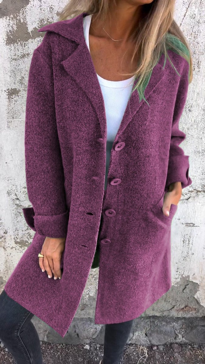 Women's longline button-up coat with lapel collar, oversized fit by Christine Brewer, styled for a chic, relaxed look.