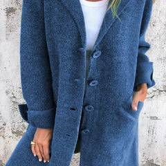 Women’s oversized longline coat with lapel collar by Christine Brewer, featuring button-up front and relaxed fit.