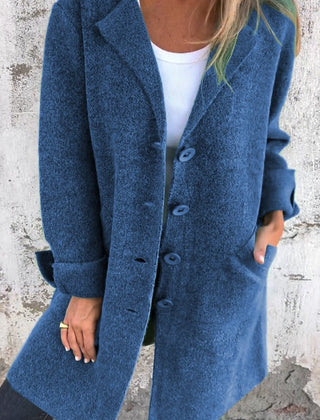 Women’s oversized longline coat with lapel collar by Christine Brewer, featuring button-up front and relaxed fit.