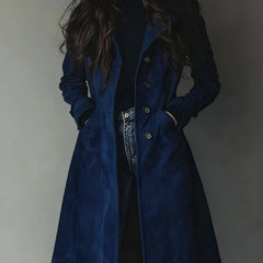 Women's longline double-breasted tailored trench coat by Christine Brewer, shown on a model, featuring classic style and structured fit.