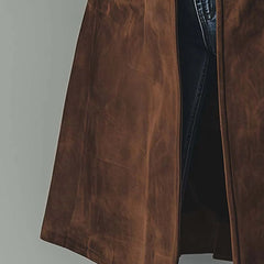 Christine Brewer women's longline double-breasted tailored trench coat hanging on a rack in neutral tones.