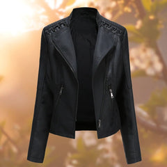 Women's faux leather biker jacket by Christine Brewer featuring a zip-up moto-style design and classic moto biker jacket details.