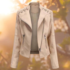Women's faux leather biker jacket by Christine Brewer featuring a zip-up moto style design on a model.