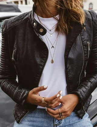 Women's faux leather moto-style zip-up jacket by Christine Brewer, featuring a sleek design and silver zipper details.