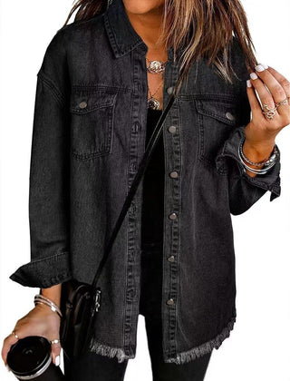 Olivia women's oversized black denim jacket with longline fit and frayed hem, stylish and casual outerwear by Christine Brewer.