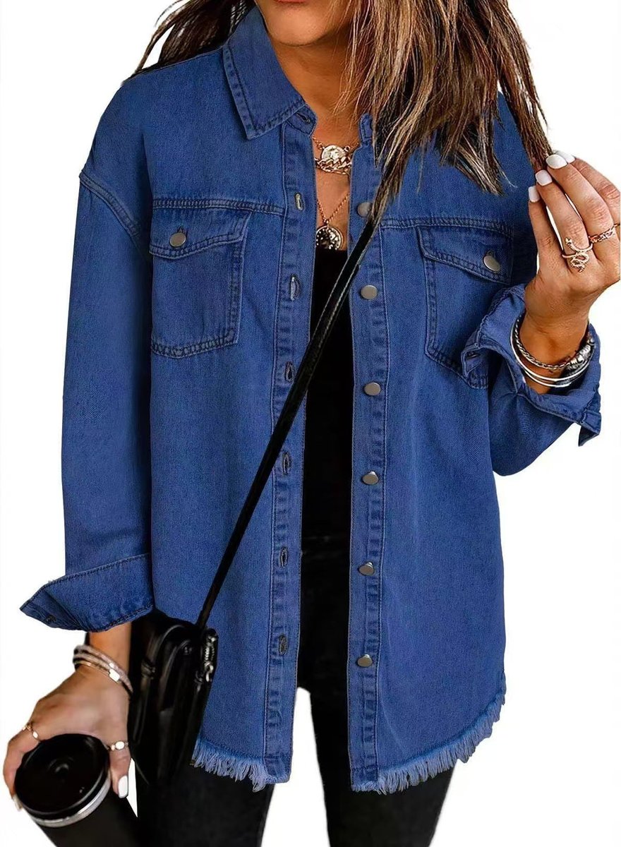 Women's oversized black denim jacket with longline fit and frayed hem, by Christine Brewer, shown on a model.