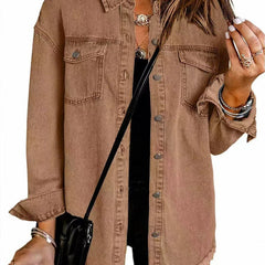 Olivia women's oversized black denim jacket by Christine Brewer with longline style and frayed hem, styled on a model.