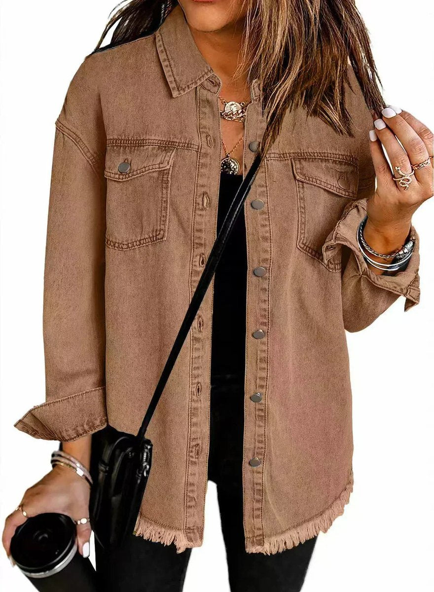 Olivia women's oversized black denim jacket by Christine Brewer with longline style and frayed hem, styled on a model.
