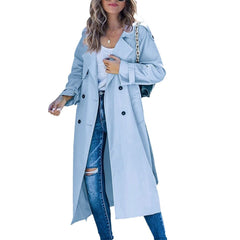 Christine Brewer Layla women's oversized double-breasted belted longline trench coat hanging on a rack, showcasing its stylish design.
