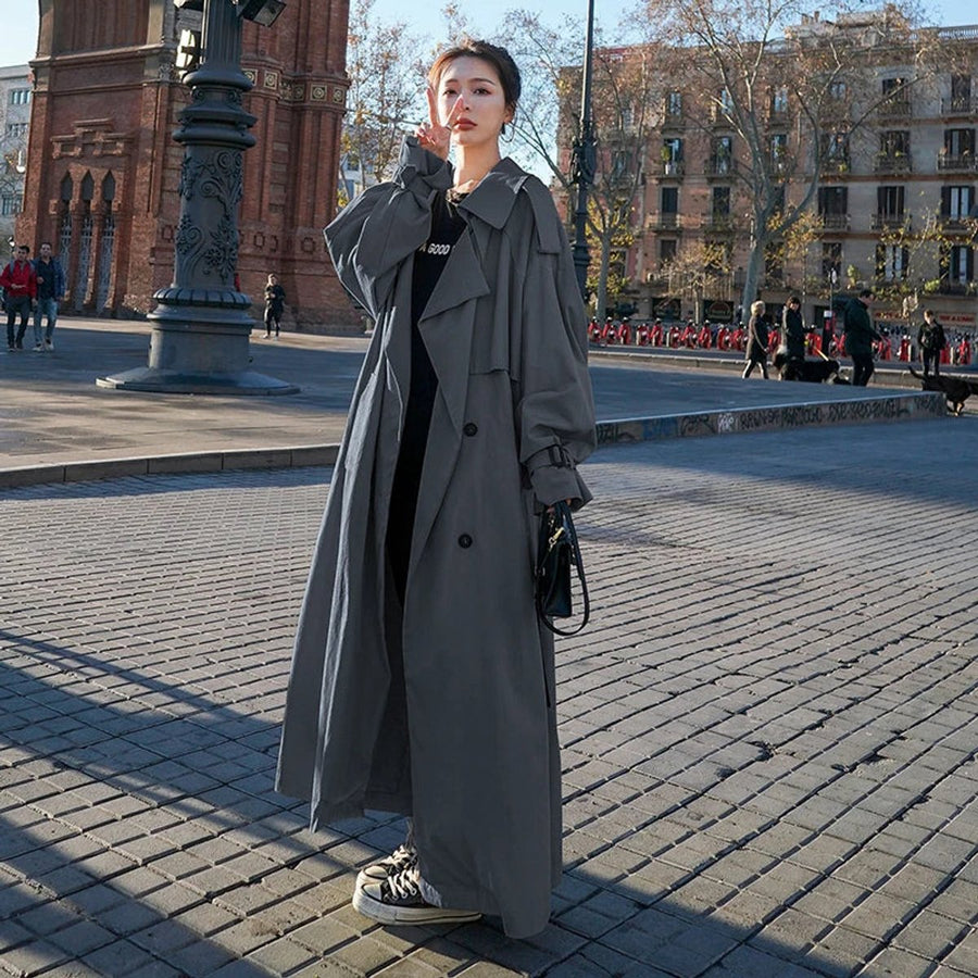 Women's oversized double-breasted long trench coat by Christine Brewer, featuring a stylish maxi design and classic trench details.