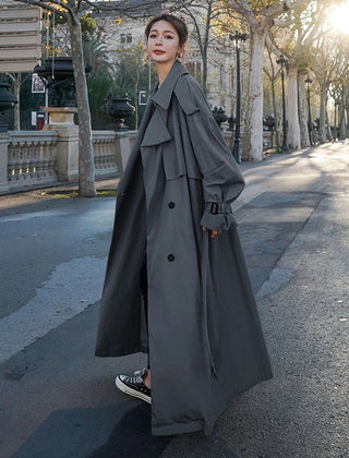 Christine Brewer Evelyn women's oversized double-breasted long trench coat, maxi length, beige fabric with wide lapels and belt.
