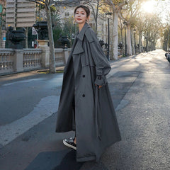 Emily women's oversized double-breasted longline trench coat by Christine Brewer, shown in a stylish, long silhouette on a model.