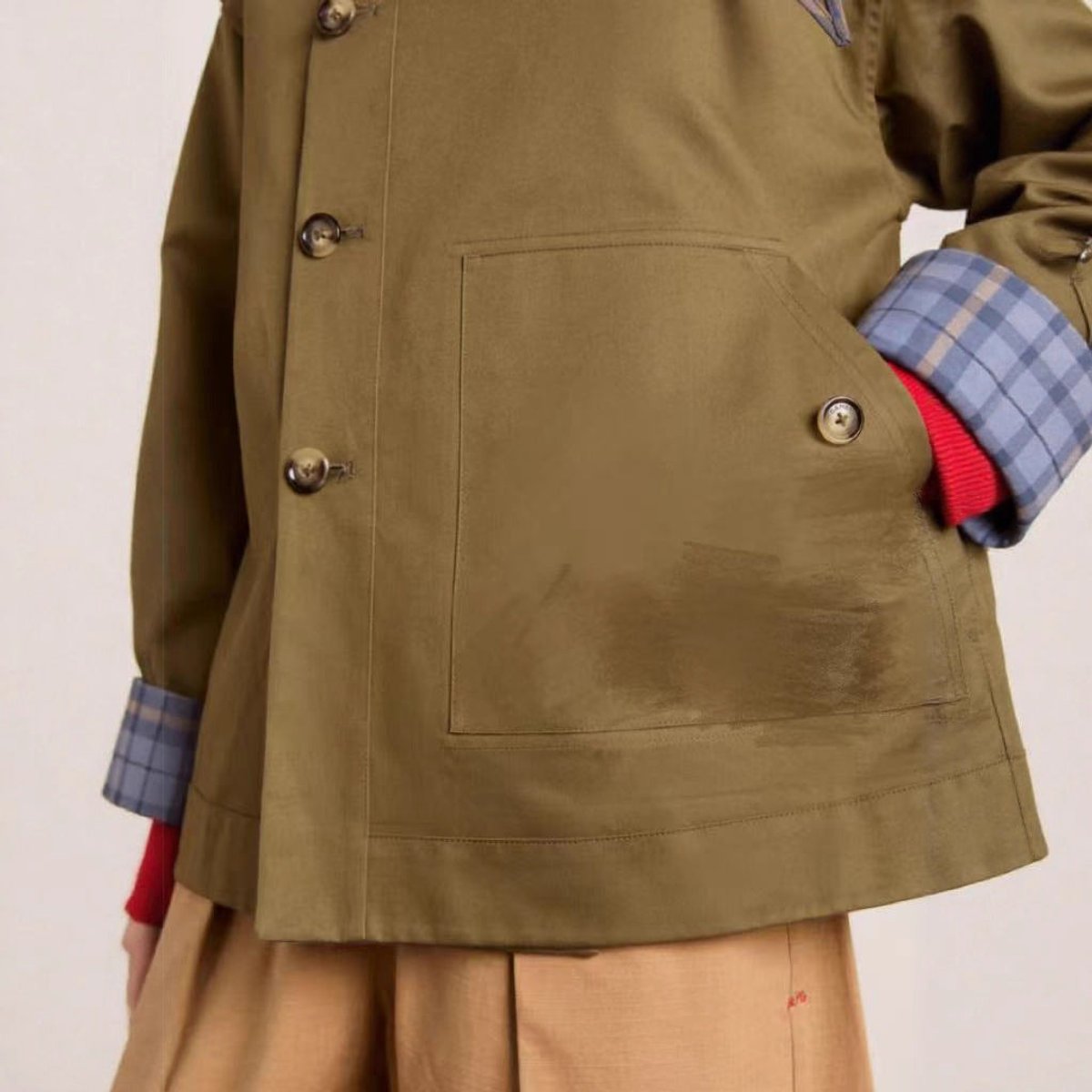 Women’s oversized double-breasted plaid-lined trench coat by Christine Brewer, showcasing classic style and warm plaid interior.