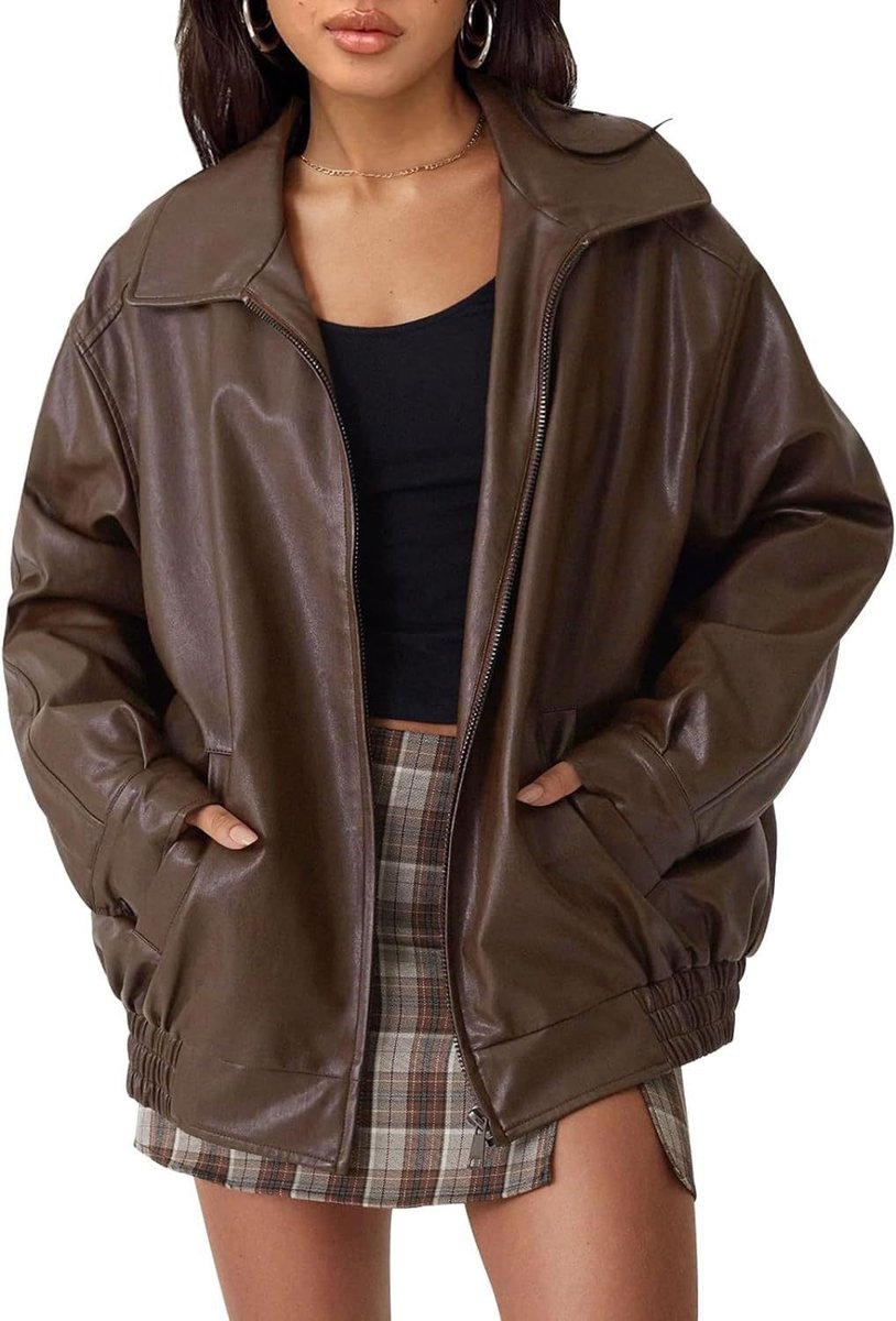 Women's oversized faux leather bomber jacket by Christine Brewer, featuring a zip-up front and stylish design.