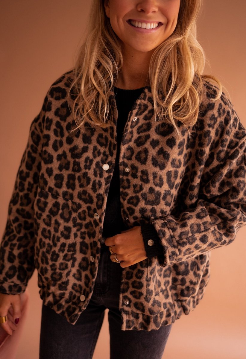 Evelyn women's oversized leopard print quilted jacket with snap buttons, stylish animal print outerwear by Christine Brewer.