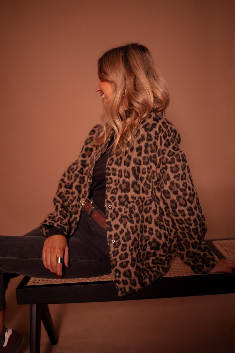 Evelyn women's oversized leopard print quilted jacket with snap buttons, featuring bold animal print and stylish design.