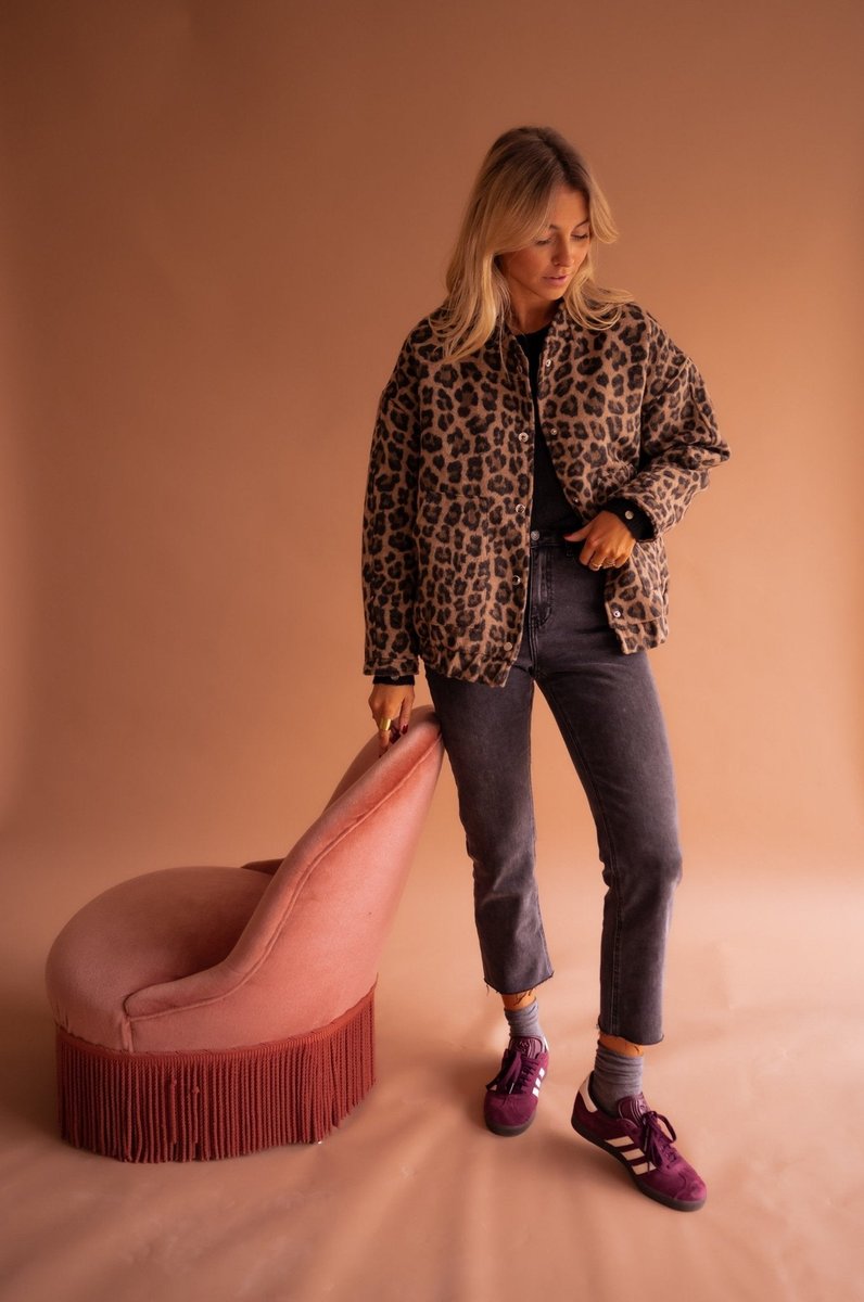 Women's oversized leopard print quilted jacket with snap buttons by Christine Brewer, featuring a stylish animal print design.