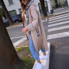 Women’s oversized long hooded zip-up coat by Christine Brewer, featuring a relaxed fit and front zipper, ideal for casual winter wear.