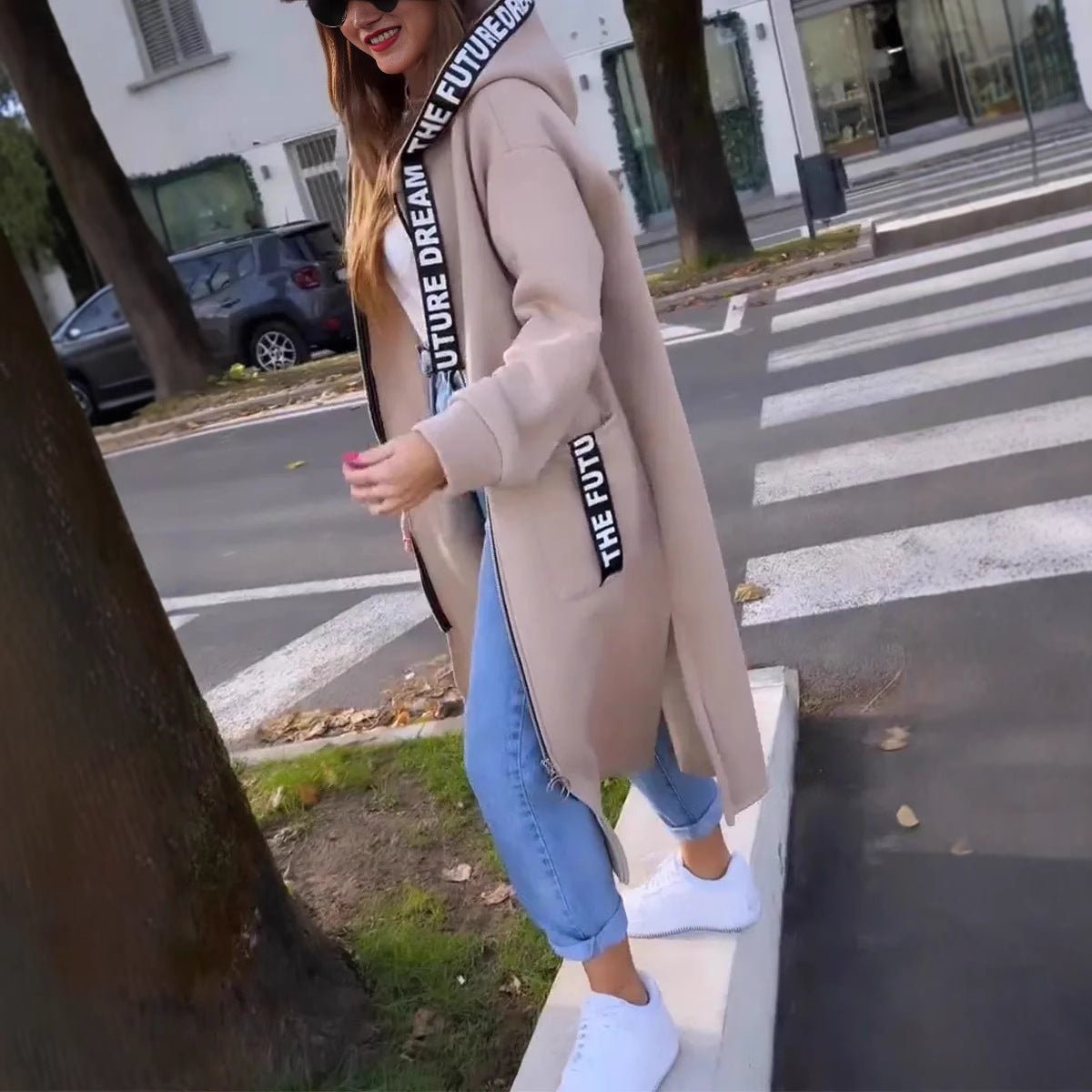 Women’s oversized long hooded zip-up coat by Christine Brewer, featuring a relaxed fit and front zipper, ideal for casual winter wear.