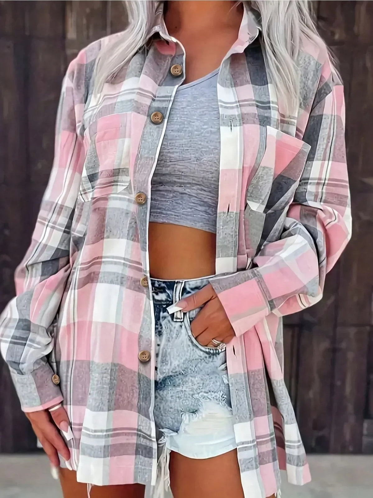 Women's oversized plaid flannel long sleeve button-up shirt by Christine Brewer, featuring a relaxed fit and classic checkered pattern.