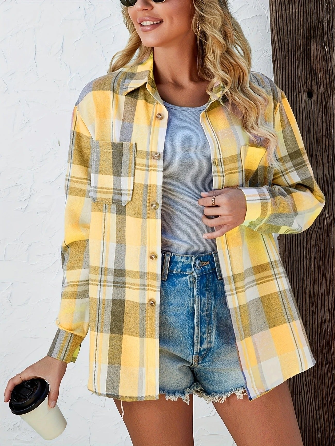 Christine Brewer women's oversized plaid flannel long sleeve button-up shirt, featuring a classic red and black checkered design.