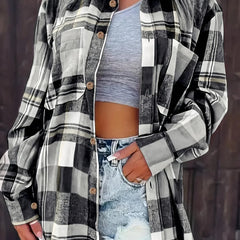 Women’s oversized plaid flannel long sleeve button-up shirt by Christine Brewer, featuring a classic relaxed fit and bold plaid pattern.