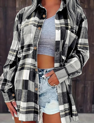 Women’s oversized plaid flannel long sleeve button-up shirt by Christine Brewer, featuring a classic relaxed fit and bold plaid pattern.