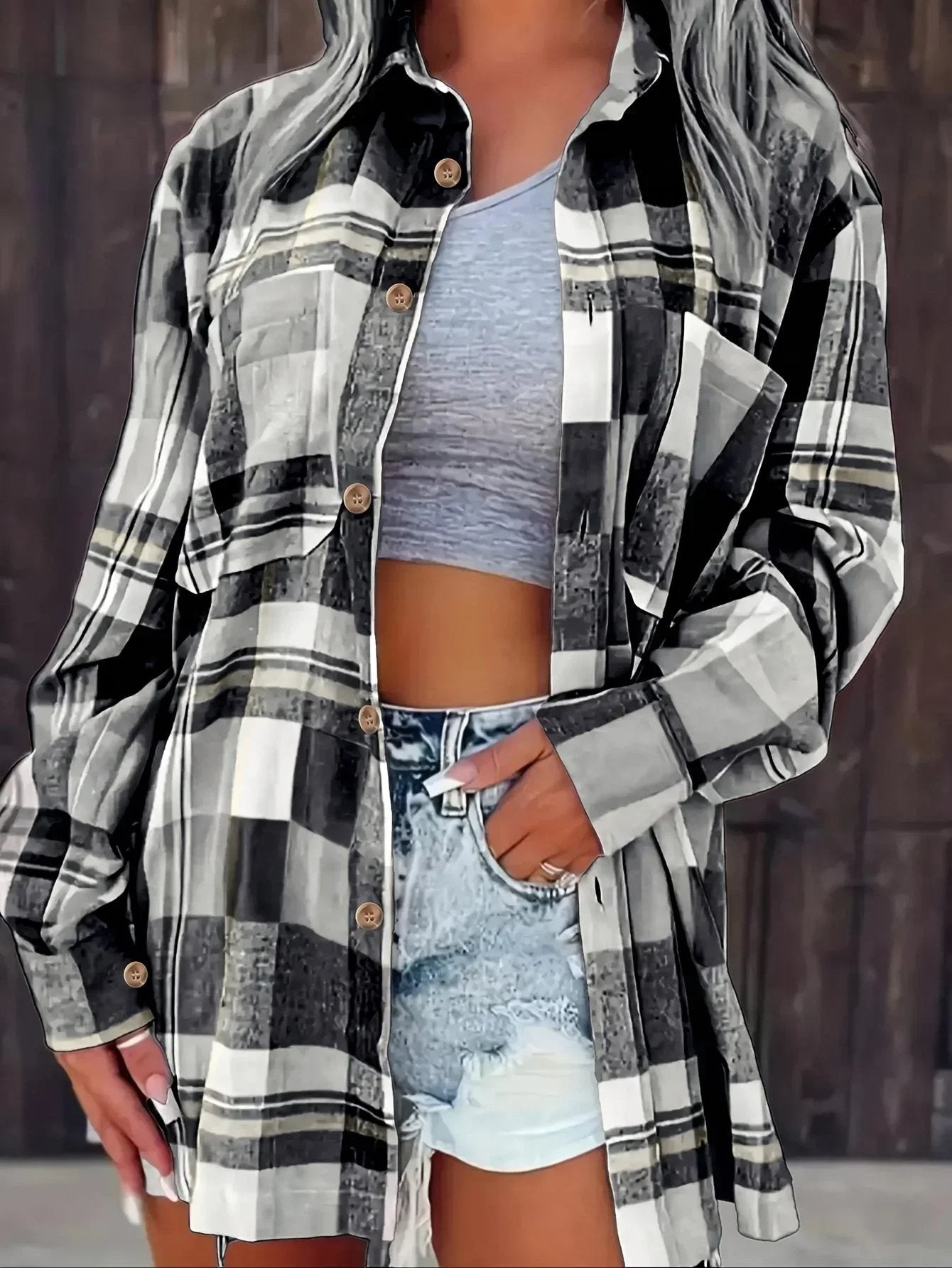Women’s oversized plaid flannel long sleeve button-up shirt by Christine Brewer, featuring a classic relaxed fit and bold plaid pattern.