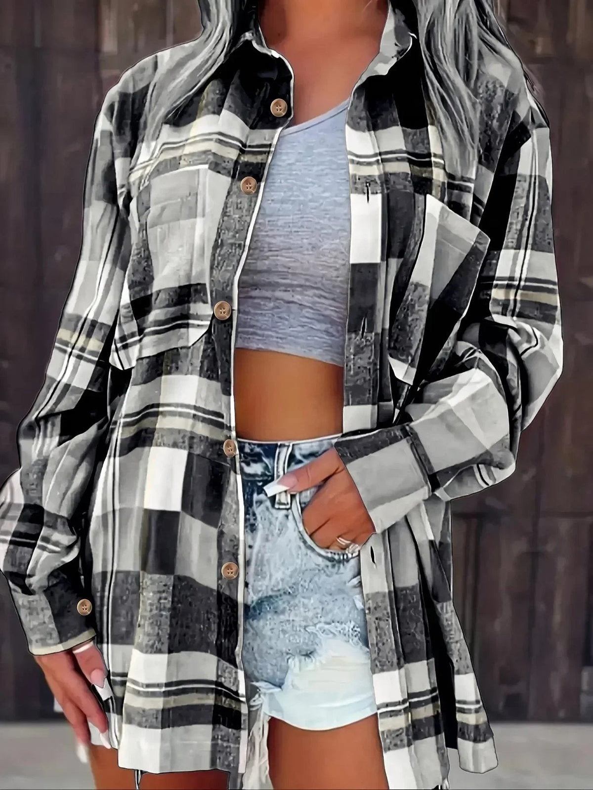 Women’s oversized plaid flannel long sleeve button-up shirt by Christine Brewer, featuring a classic relaxed fit and bold plaid pattern.