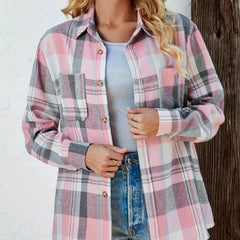 Women’s oversized plaid flannel long sleeve button-up shirt by Christine Brewer, featuring a classic red and black checkered pattern.
