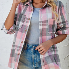 Women's oversized plaid flannel long sleeve button-up shirt by Christine Brewer, featuring a classic checkered pattern and relaxed fit.