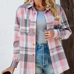 Women’s oversized plaid flannel long sleeve button-up shirt by Christine Brewer, featuring a classic red and black checkered pattern.