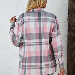 Women's oversized plaid flannel long sleeve button-up shirt by Christine Brewer, featuring a classic checkered pattern and relaxed fit.