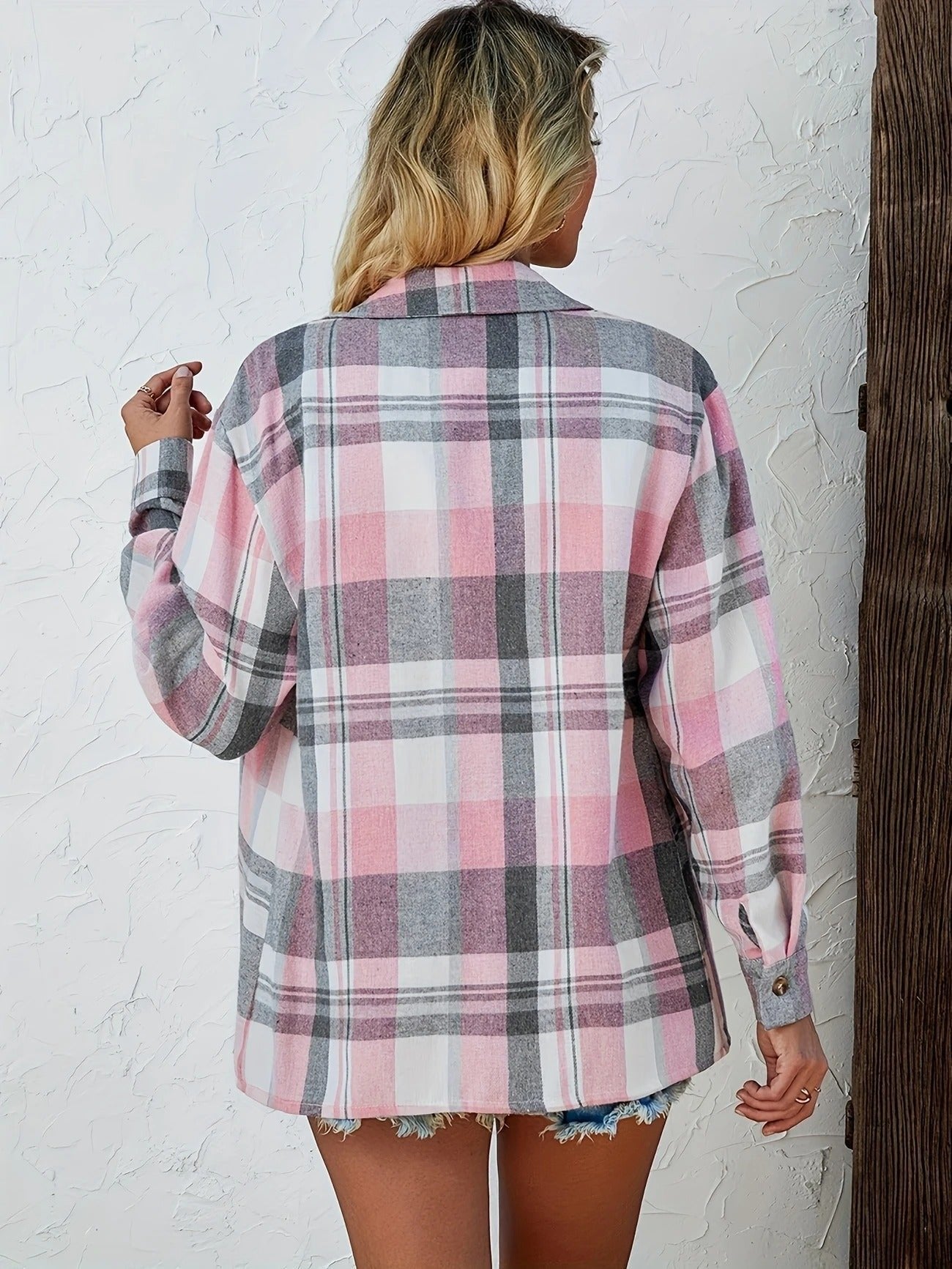 Women's oversized plaid flannel long sleeve button-up shirt by Christine Brewer, featuring a classic checkered pattern and relaxed fit.