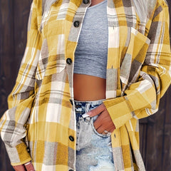 Women’s oversized plaid flannel long sleeve button-up shirt by Christine Brewer, featuring classic checkered pattern in warm tones.