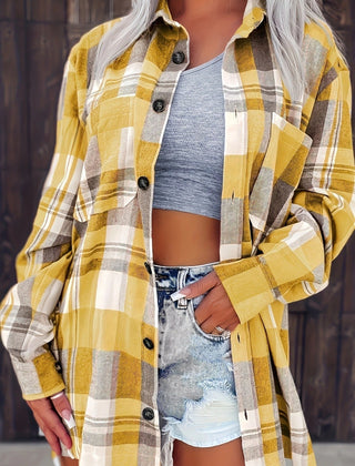 Women’s oversized plaid flannel long sleeve button-up shirt by Christine Brewer, featuring classic checkered pattern in warm tones.