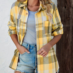 Women's oversized plaid flannel long sleeve button-up shirt by Christine Brewer, featuring a relaxed fit and classic plaid pattern.