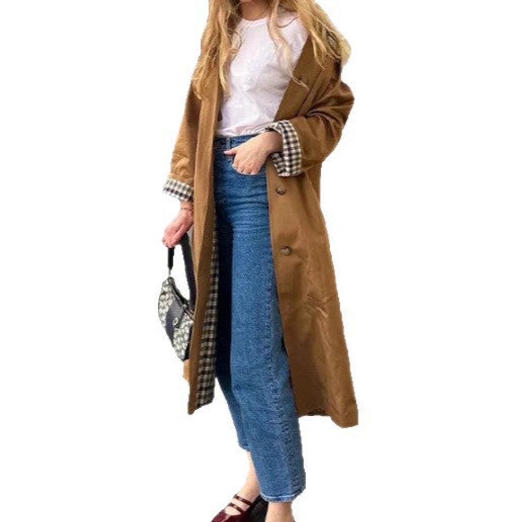 Women's oversized trench coat with plaid lining, cotton blend fabric and classic design by Christine Brewer.
